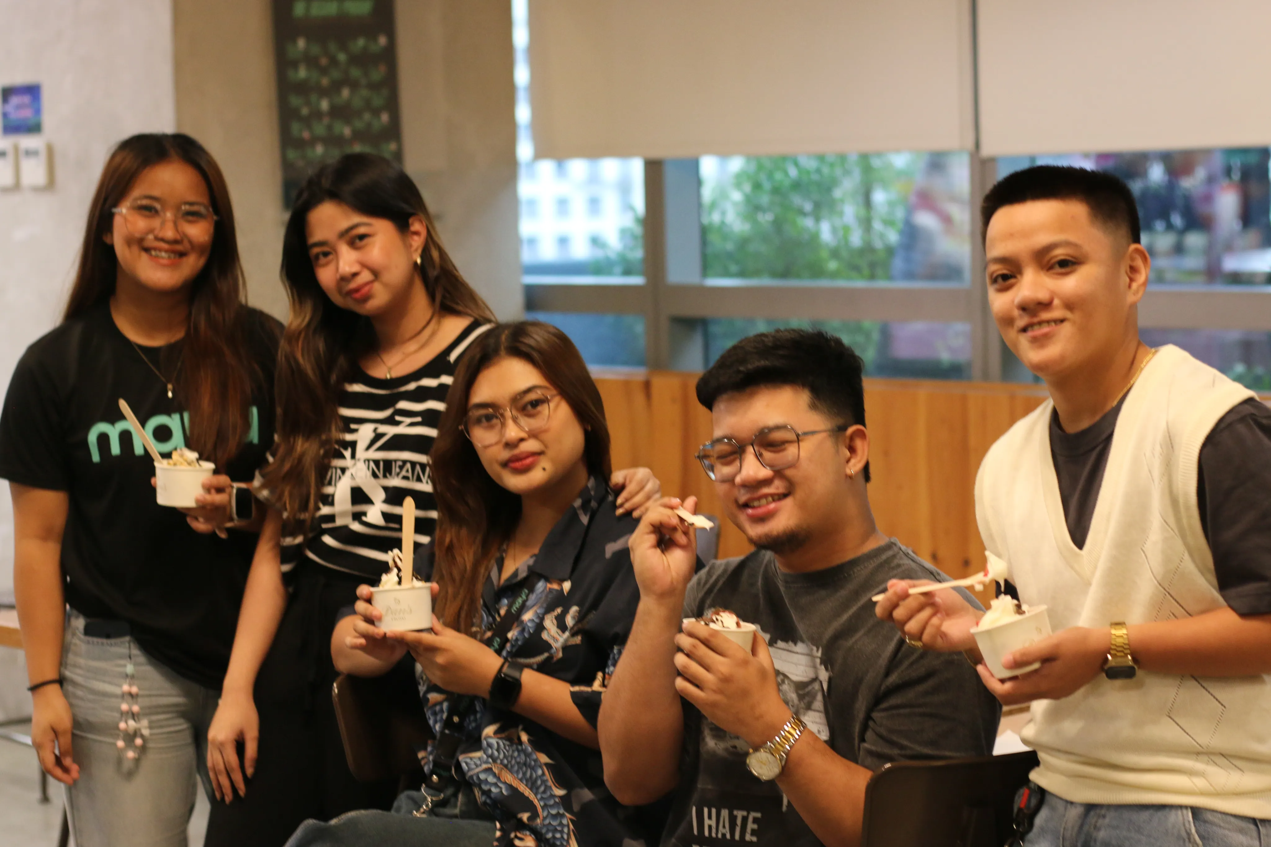 Team members at a corporate wellness event enjoying Dan's Froyo