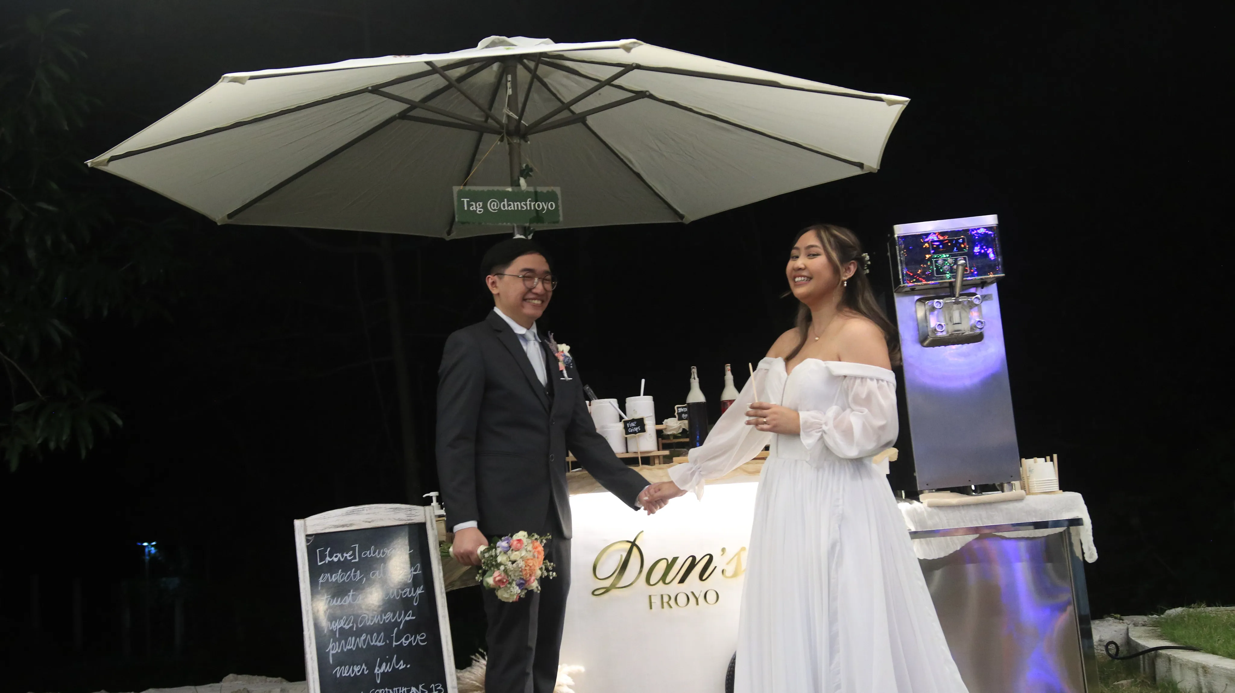 Dan's Froyo cart at a wedding reception with elegant table setup