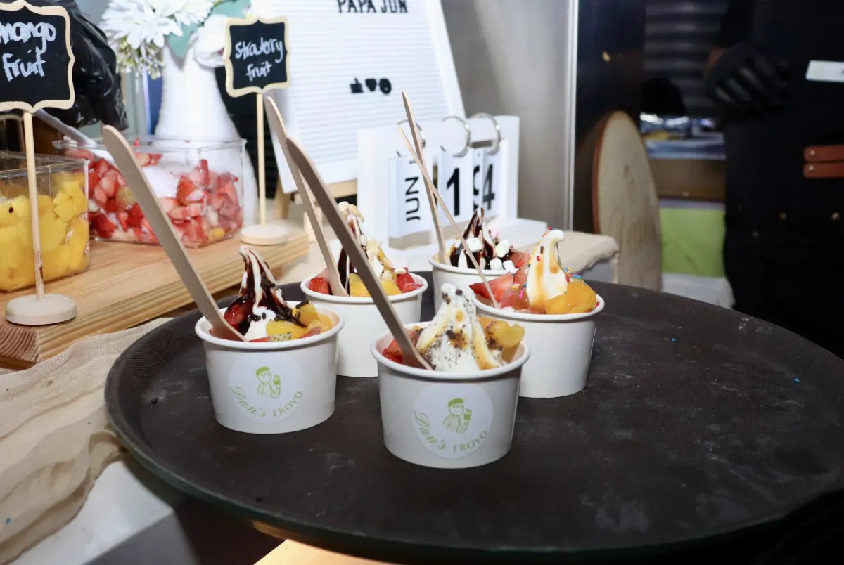 Dan's Froyo cart with branded signage and props